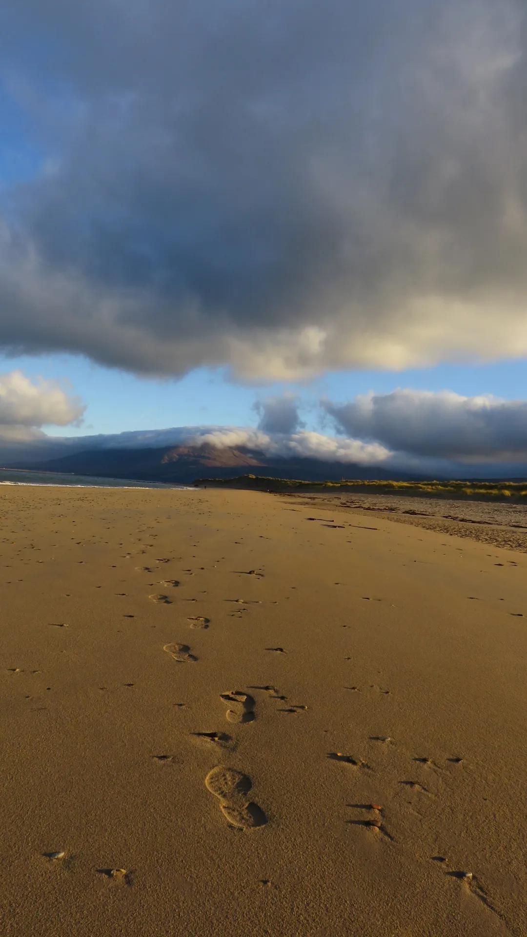 Footprints crossing a beach on the Dingle Peninsula in County Kerry.